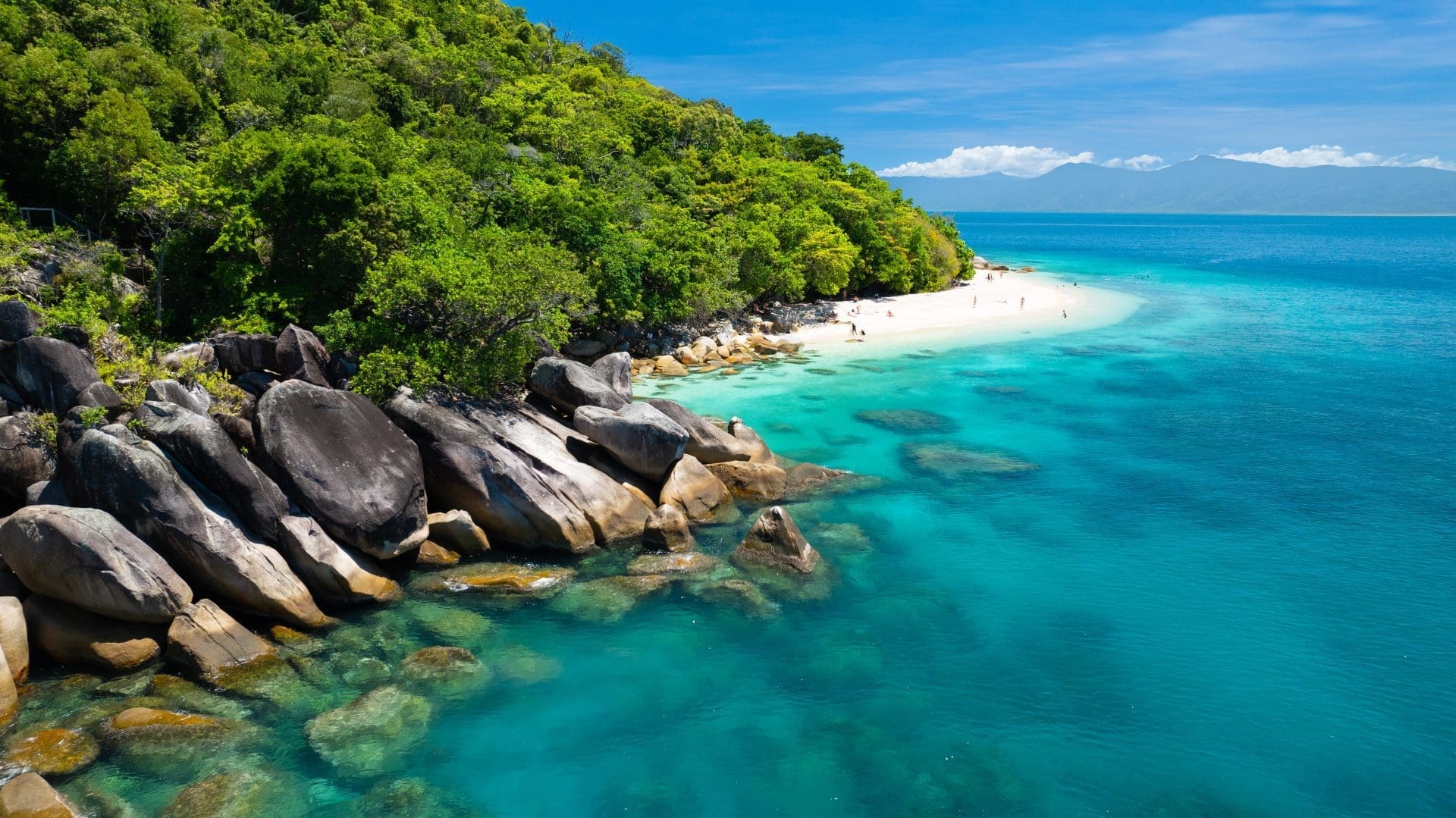 Aerial view of Fitzroy Island where rainforest meets the beach and reef